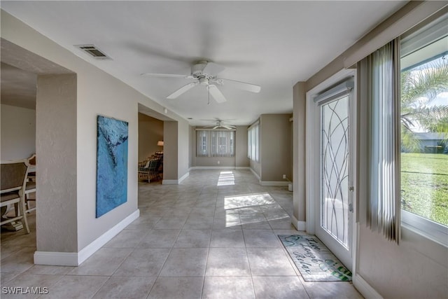 5549 Westwind Ln, Fort Myers, FL 33919 - foyer entrance featuring healthy amount of natural light, ceiling fan, and light tile patterned floors
