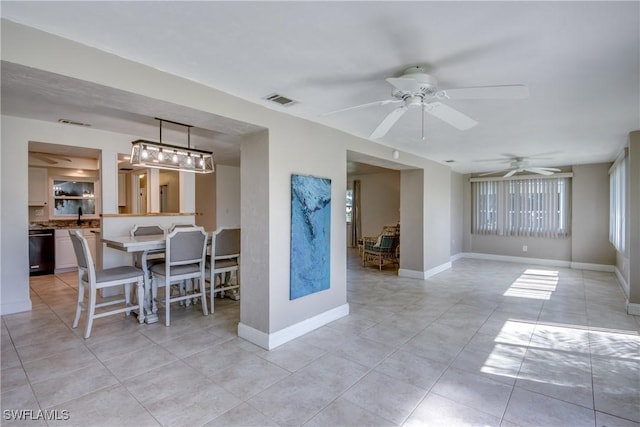 5549 Westwind Ln, Fort Myers, FL 33919 - dining area with ceiling fan and light tile patterned floors