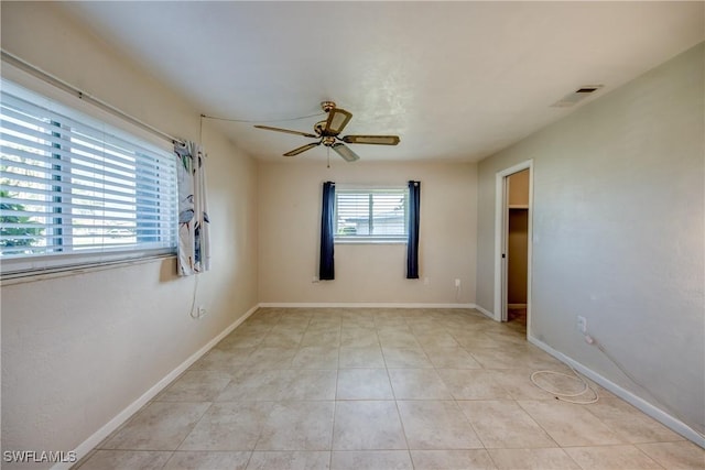 5549 Westwind Ln, Fort Myers, FL 33919 - spare room with ceiling fan and light tile patterned floors