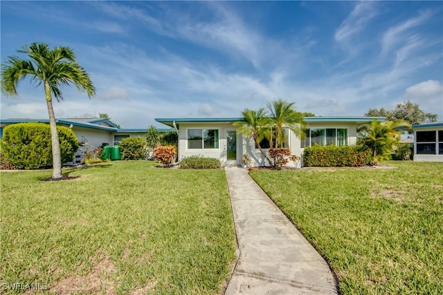 5549 Westwind Ln, Fort Myers, FL 33919 - ranch-style home featuring a front yard and stucco siding