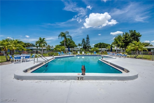 5549 Westwind Ln, Fort Myers, FL 33919 - community pool featuring a patio