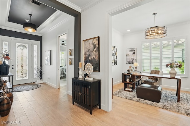 17467 Caravita Ln, Fort Myers, FL 33913 - foyer entrance with light wood-type flooring, ornamental molding, and a chandelier