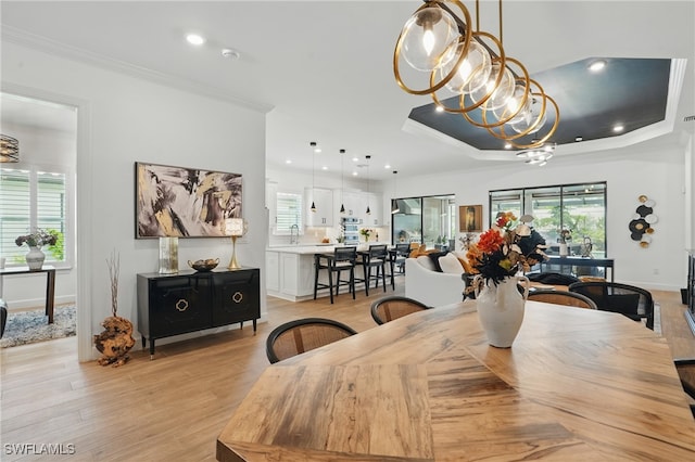 17467 Caravita Ln, Fort Myers, FL 33913 - dining area with crown molding, a chandelier, light wood-style flooring, and recessed lighting