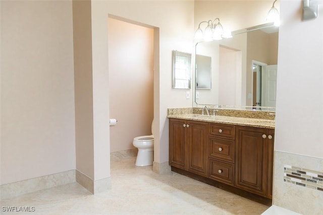892 Grand Rapids Blvd, Naples, FL 34120 - bathroom with toilet, double vanity, and a bath