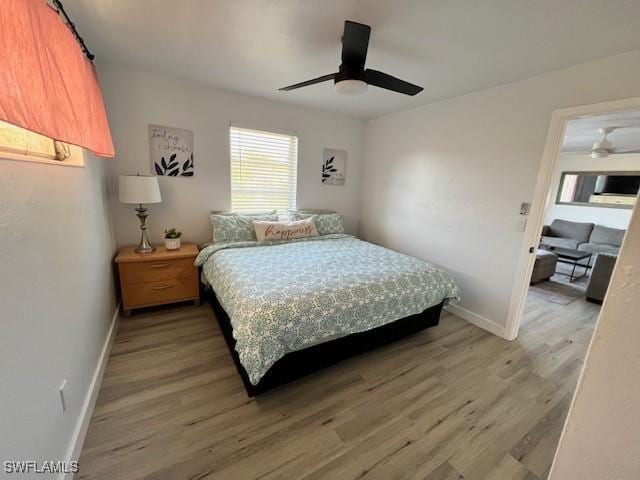 1661 Coronado Rd, Fort Myers, FL 33901 - bedroom with light wood-style floors and ceiling fan
