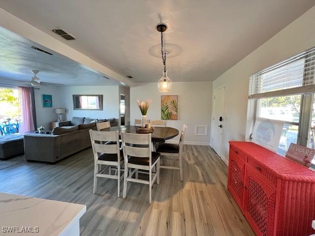 1661 Coronado Rd, Fort Myers, FL 33901 - dining room with wood finished floors and a ceiling fan