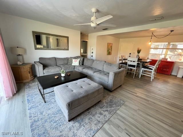 1661 Coronado Rd, Fort Myers, FL 33901 - living room featuring light wood-style floors and a ceiling fan