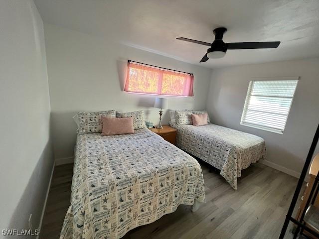 1661 Coronado Rd, Fort Myers, FL 33901 - bedroom featuring wood finished floors and ceiling fan