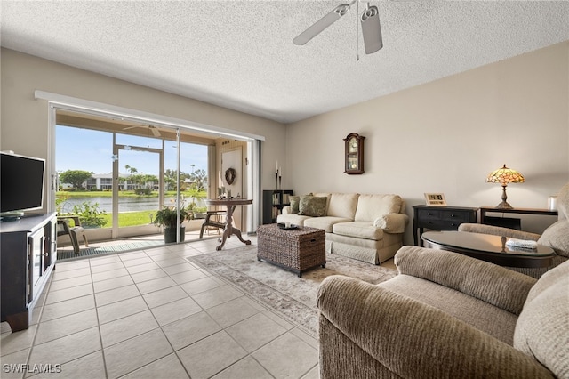 7152 Blanquilla Ct Unit 5, Fort Myers, FL 33908 - living area featuring a ceiling fan, light tile patterned floors, and a textured ceiling