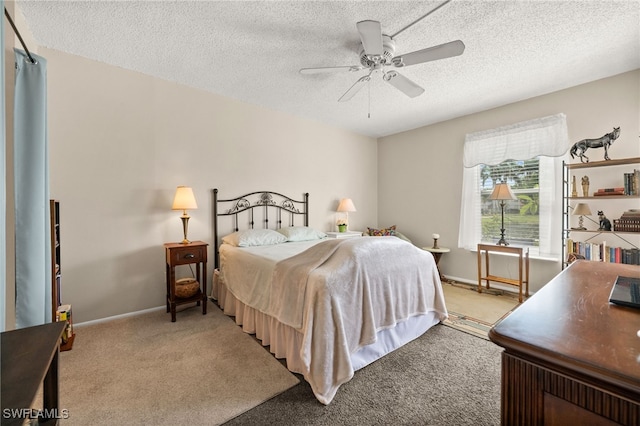 7152 Blanquilla Ct Unit 5, Fort Myers, FL 33908 - bedroom featuring carpet flooring, a textured ceiling, and a ceiling fan