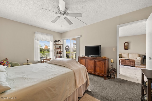 7152 Blanquilla Ct Unit 5, Fort Myers, FL 33908 - bedroom featuring light colored carpet, a textured ceiling, and a ceiling fan