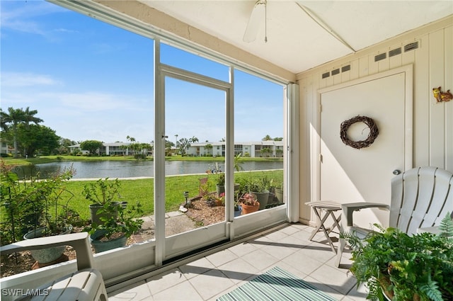 7152 Blanquilla Ct Unit 5, Fort Myers, FL 33908 - sunroom with tile patterned floors, a water view, and a ceiling fan