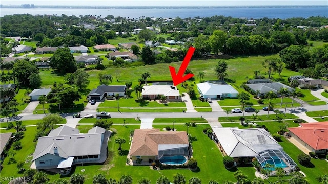4180 Prestwick Ct, North Fort Myers, FL 33903 - aerial perspective of suburban area featuring a large body of water