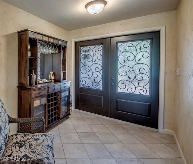 4180 Prestwick Ct, North Fort Myers, FL 33903 - entryway featuring french doors and light tile patterned floors