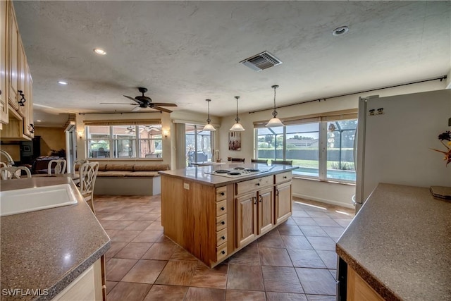 4180 Prestwick Ct, North Fort Myers, FL 33903 - kitchen with white appliances, a ceiling fan, light brown cabinetry, open floor plan, and recessed lighting