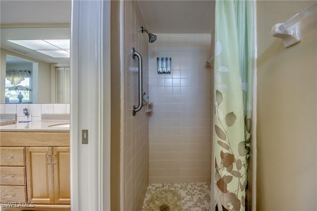 4180 Prestwick Ct, North Fort Myers, FL 33903 - bathroom featuring a tile shower and vanity