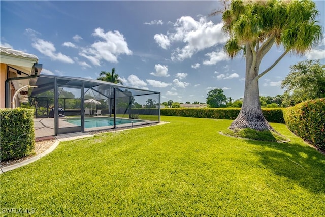 4180 Prestwick Ct, North Fort Myers, FL 33903 - view of green lawn featuring an outdoor pool and a lanai