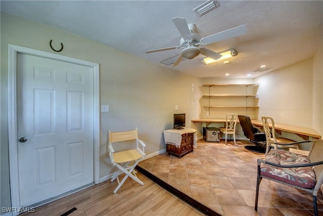 4180 Prestwick Ct, North Fort Myers, FL 33903 - office area with a ceiling fan, built in study area, and wood finished floors