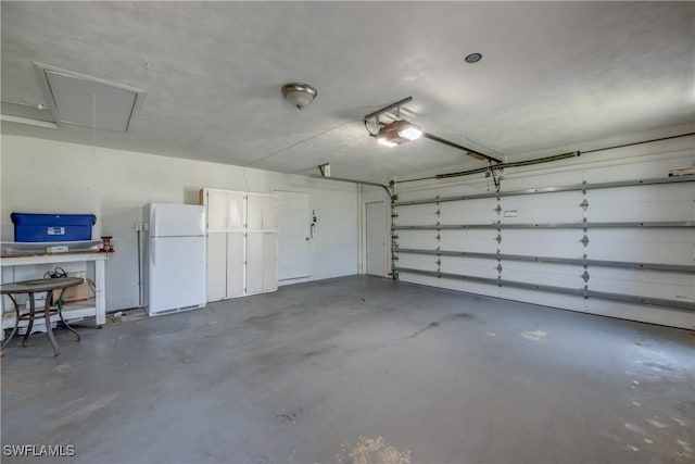4180 Prestwick Ct, North Fort Myers, FL 33903 - garage with freestanding refrigerator and a garage door opener