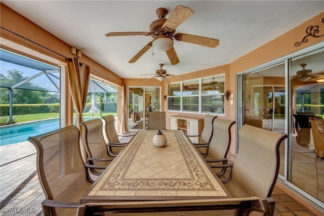 4180 Prestwick Ct, North Fort Myers, FL 33903 - sunroom featuring ceiling fan, outdoor dining area, and plenty of natural light