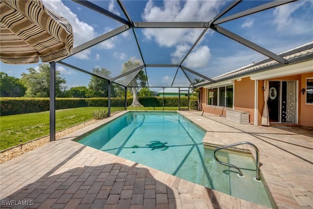 4180 Prestwick Ct, North Fort Myers, FL 33903 - outdoor pool with a patio, a yard, and glass enclosure