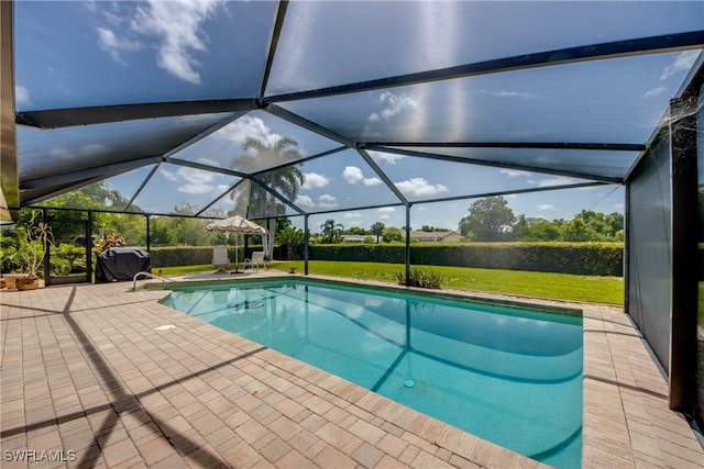 4180 Prestwick Ct, North Fort Myers, FL 33903 - outdoor pool featuring a patio, a yard, and glass enclosure