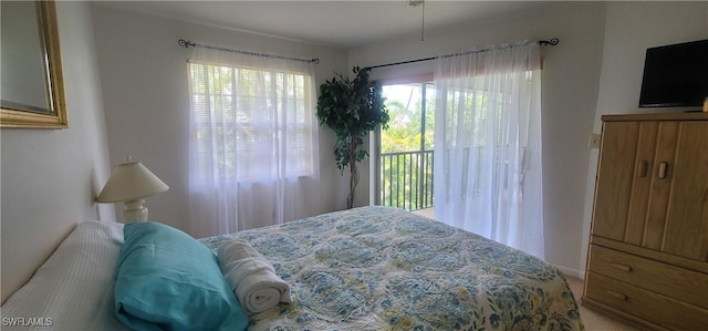 4213 SE 19th Ave Unit 208, Cape Coral, FL 33904 - bedroom with access to exterior and carpet flooring