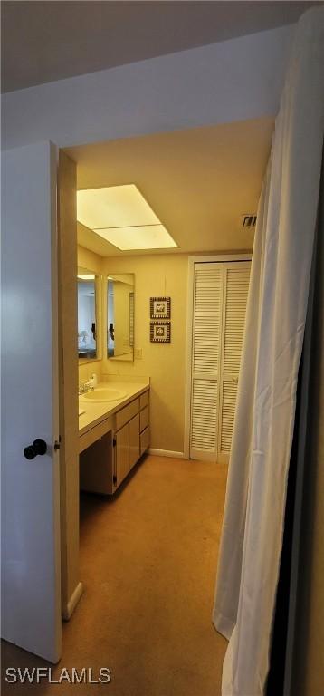 4213 SE 19th Ave Unit 208, Cape Coral, FL 33904 - bathroom with vanity and baseboards