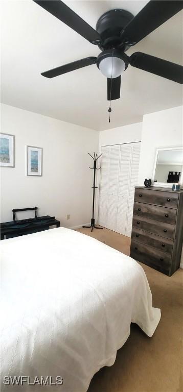 4213 SE 19th Ave Unit 208, Cape Coral, FL 33904 - carpeted bedroom featuring a ceiling fan and a closet