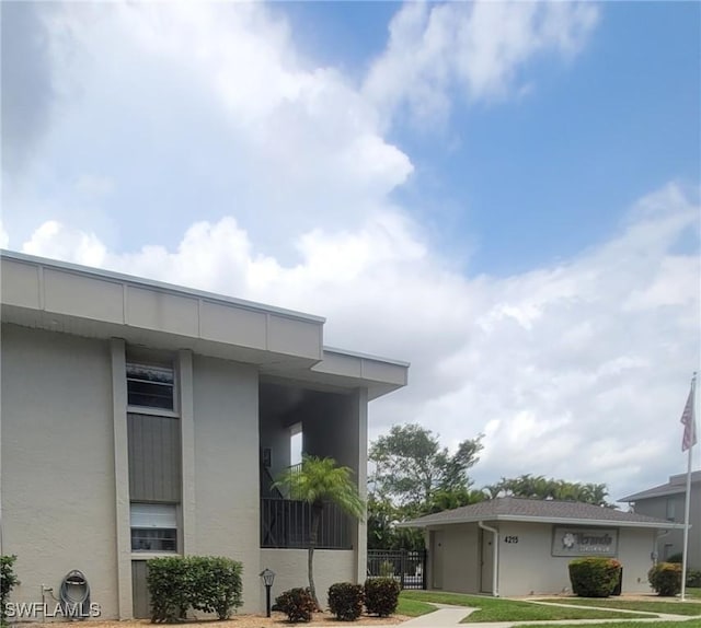 4213 SE 19th Ave Unit 208, Cape Coral, FL 33904 - view of property exterior with stucco siding