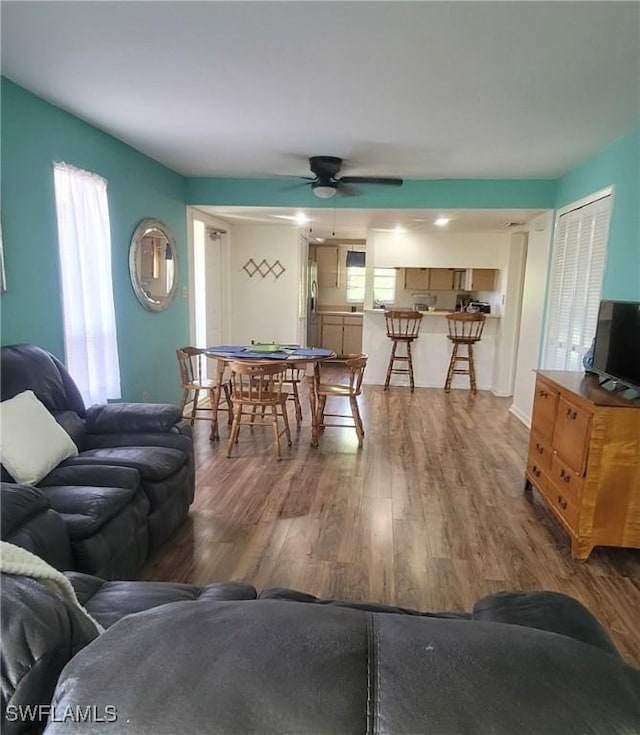 4213 SE 19th Ave Unit 208, Cape Coral, FL 33904 - living area with a ceiling fan and wood finished floors