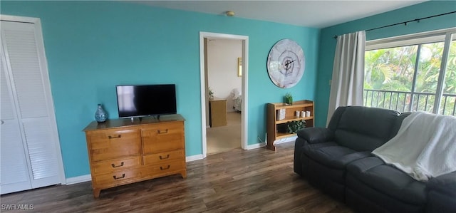 4213 SE 19th Ave Unit 208, Cape Coral, FL 33904 - living room with dark wood-style floors and baseboards