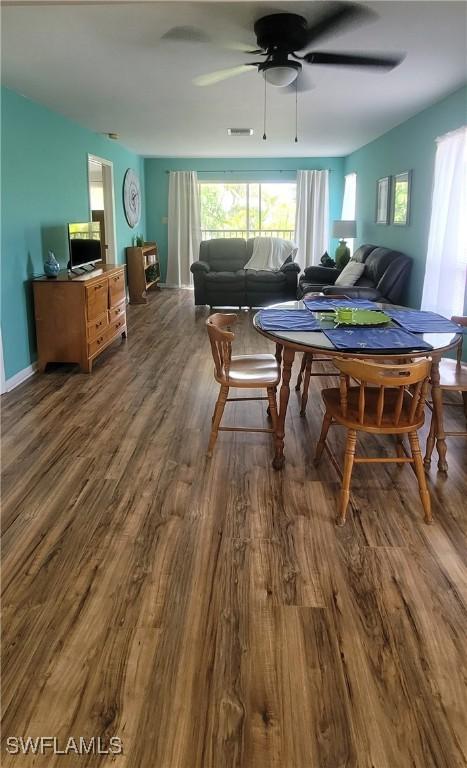 4213 SE 19th Ave Unit 208, Cape Coral, FL 33904 - dining area with wood finished floors and a ceiling fan