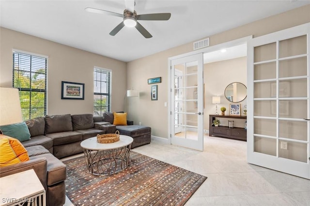 4012 E Hampton Cir, Alva, FL 33920 - living area with french doors, a ceiling fan, and light tile patterned floors