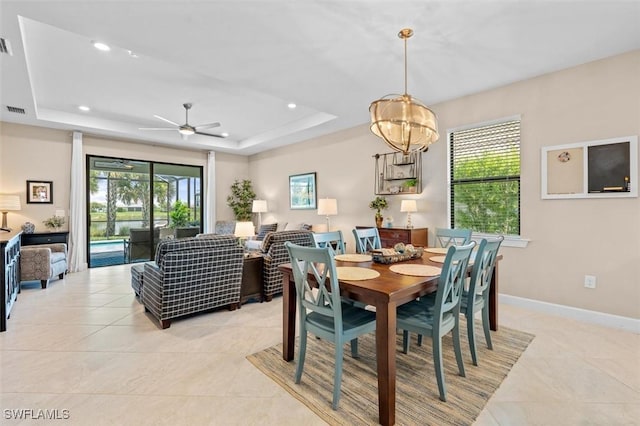4012 E Hampton Cir, Alva, FL 33920 - dining area featuring light tile patterned floors, a tray ceiling, recessed lighting, and ceiling fan