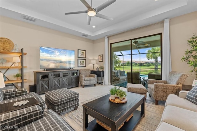 4012 E Hampton Cir, Alva, FL 33920 - living room featuring a tray ceiling, ceiling fan, and recessed lighting