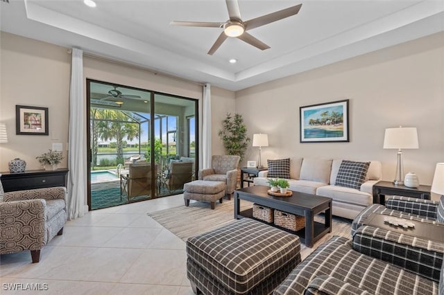 4012 E Hampton Cir, Alva, FL 33920 - living area with ceiling fan, a raised ceiling, a sunroom, recessed lighting, and light tile patterned flooring
