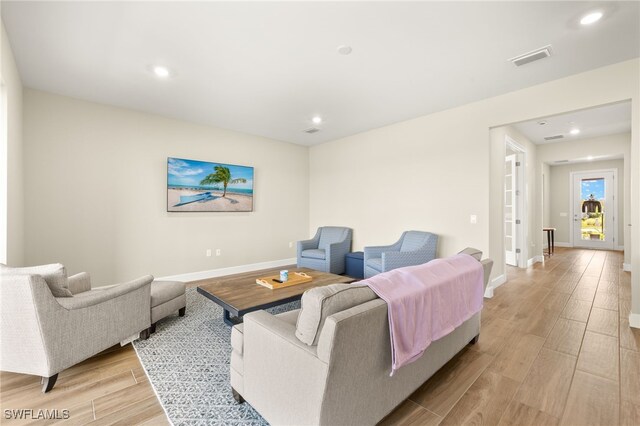 20676 Napa Loop, Estero, FL 33928 - living room featuring light wood-type flooring and recessed lighting