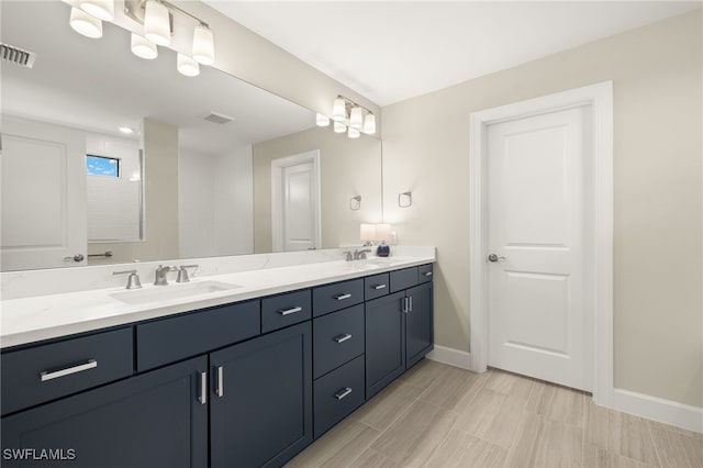 20676 Napa Loop, Estero, FL 33928 - bathroom with double vanity and baseboards