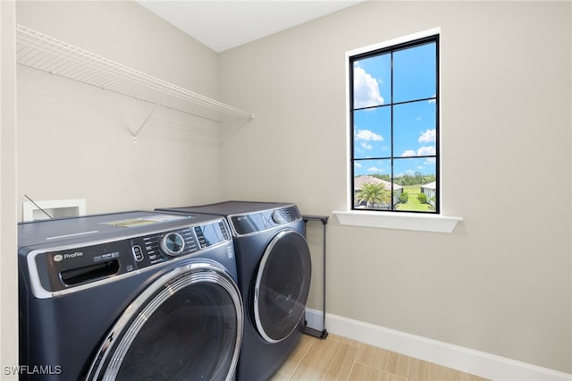 20676 Napa Loop, Estero, FL 33928 - washroom featuring washing machine and dryer and baseboards