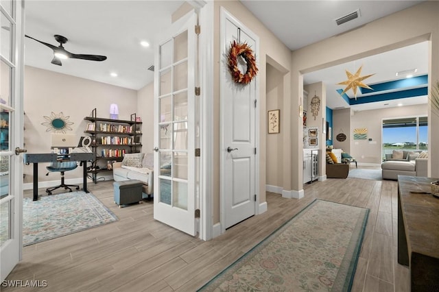 42274 Waterfront Way, Punta Gorda, FL 33982 - hallway with a desk, wood finished floors, and french doors