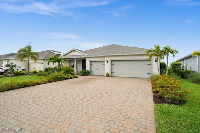 42274 Waterfront Way, Punta Gorda, FL 33982 - ranch-style home featuring decorative driveway, an attached garage, stucco siding, and a front lawn
