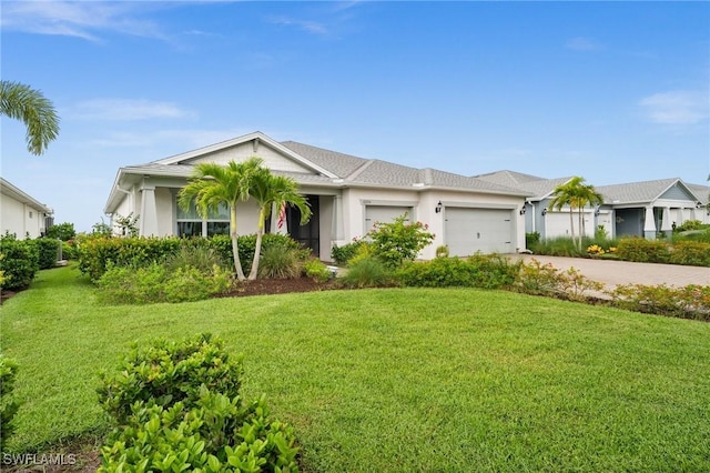 42274 Waterfront Way, Punta Gorda, FL 33982 - ranch-style house with driveway, a garage, a front lawn, and stucco siding