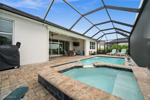 42274 Waterfront Way, Punta Gorda, FL 33982 - view of pool with a ceiling fan, a pool with connected hot tub, a patio area, and glass enclosure