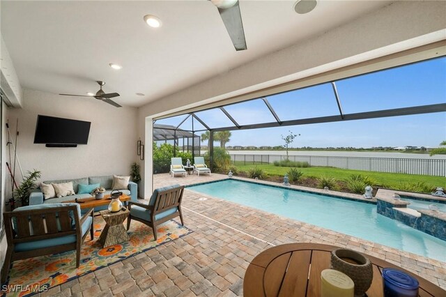 42274 Waterfront Way, Punta Gorda, FL 33982 - view of swimming pool featuring a water view, a patio, an outdoor hangout area, ceiling fan, and a pool with connected hot tub