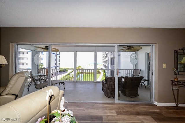 7000 Estero Blvd Unit 205, Fort Myers Beach, FL 33931 - living room with ceiling fan, plenty of natural light, and wood finished floors