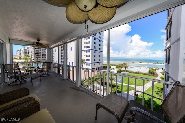 7000 Estero Blvd Unit 205, Fort Myers Beach, FL 33931 - sunroom with ceiling fan and a water view