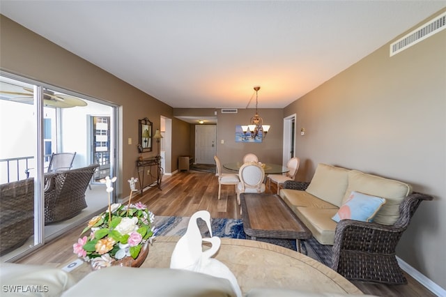 7000 Estero Blvd Unit 205, Fort Myers Beach, FL 33931 - living room featuring wood finished floors and a chandelier
