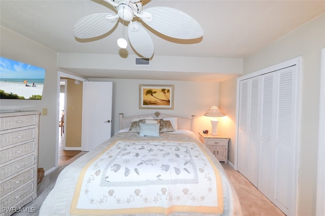 7000 Estero Blvd Unit 205, Fort Myers Beach, FL 33931 - bedroom with light carpet, a closet, a water view, and a ceiling fan
