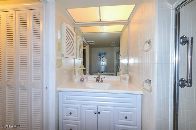 7000 Estero Blvd Unit 205, Fort Myers Beach, FL 33931 - bathroom with a closet, vanity, and tile walls